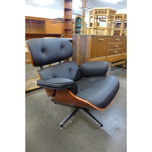 65 - A Charles & Ray Eames style simulated rosewood, chrome and faux black leather revolving lounge chair... 