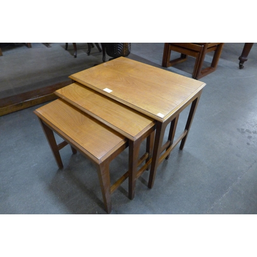 76 - A Remploy teak nest of tables