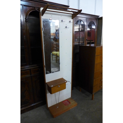 88 - A teak and cream vinyl hallstand