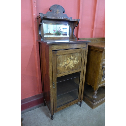 9 - An Edward VII rosewood and marquetry inlaid music cabinet