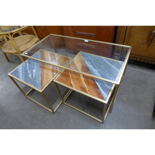 91 - An Italian style gilt metal, glass, slate and teak topped nest of tables