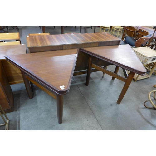 93 - A pair of teak triangular side tables