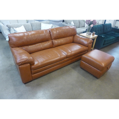 1334 - A designer tan leather three seater sofa and footstool/ottoman