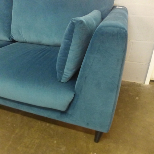 1491 - An Alice blue velvet three seater sofa - damaged leg