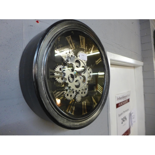 1492 - A black circular moving gears wall clock