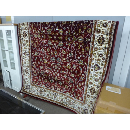 1505 - A red ground full pile Iranian carpet with all over floral pattern 200cm x 300cm