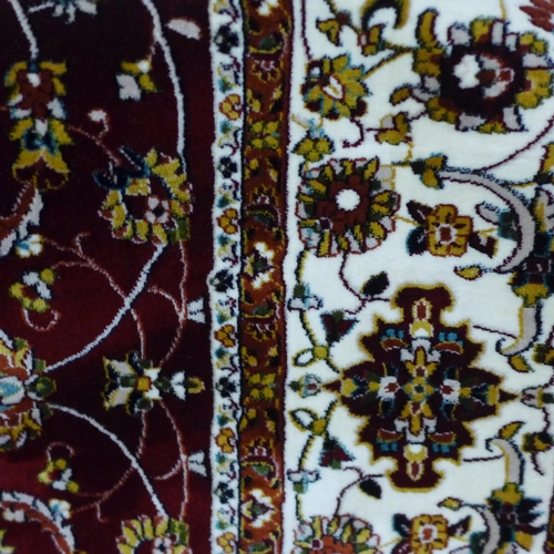 1505 - A red ground full pile Iranian carpet with all over floral pattern 200cm x 300cm