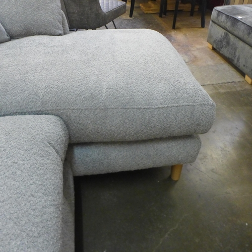 1508 - A light grey fabric three seater sofa/chaise