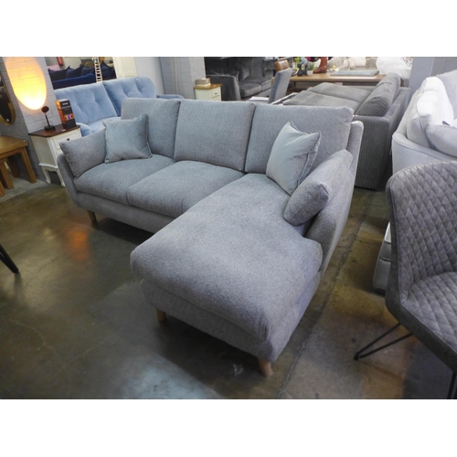 1508 - A light grey fabric three seater sofa/chaise