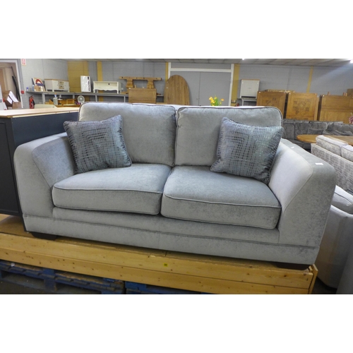 1384 - A Casey silver velvet three seater sofa