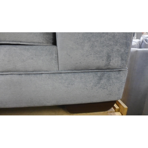 1384 - A Casey silver velvet three seater sofa