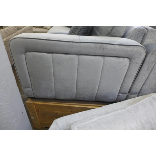 1384 - A Casey silver velvet three seater sofa