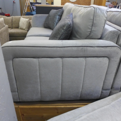 1384 - A Casey silver velvet three seater sofa