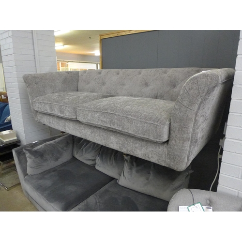 1532 - A grey button back fabric three seater sofa