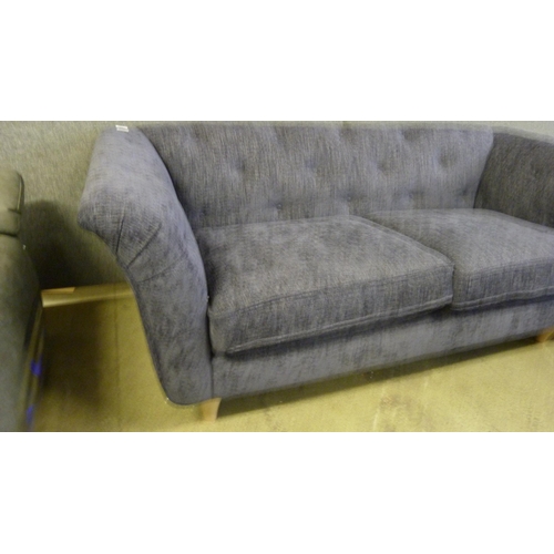 1539 - A Rebecca blue fabric button back three seater sofa