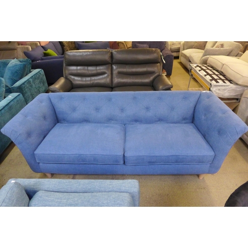 1555 - An Cadet blue fabric button back three seater sofa