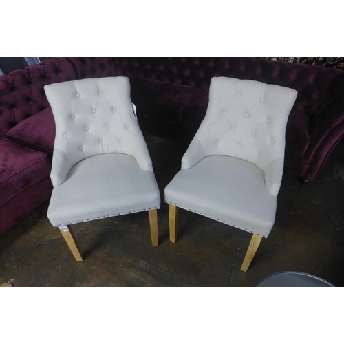 1420 - A pair of cream upholstered button back dining chairs