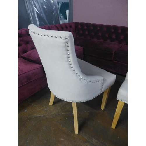 1420 - A pair of cream upholstered button back dining chairs