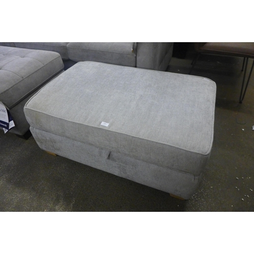 1467 - A grey upholstered ottoman footstool