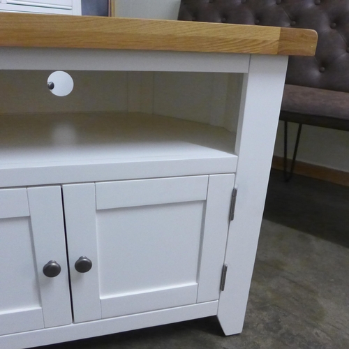 1408 - A Hampshire white painted and oak corner TV unit*This lot is subject to VAT