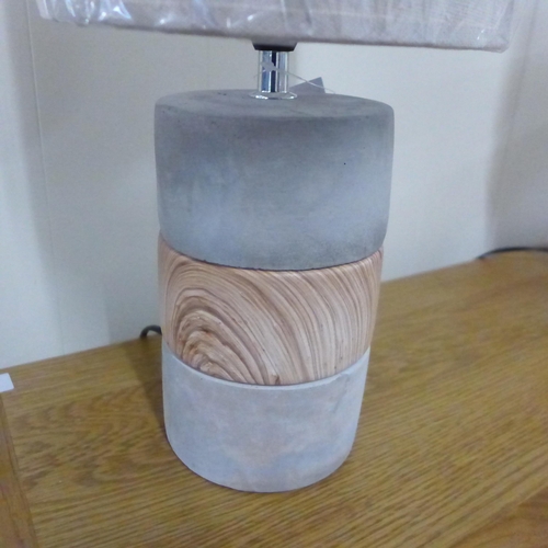 1410 - A concrete base table lamp with a decorative wooden band with linen shade, H 44cms (70376623)   #