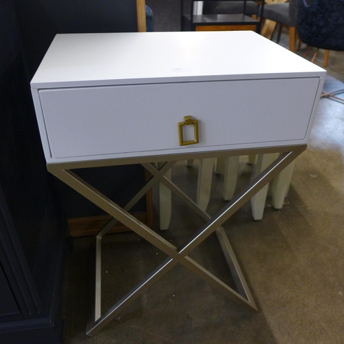 1438 - A white bedside table with cross legs (marked)