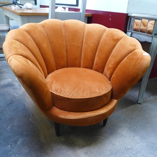 1499 - An ochre velvet shell armchair *This lot is subject to VAT