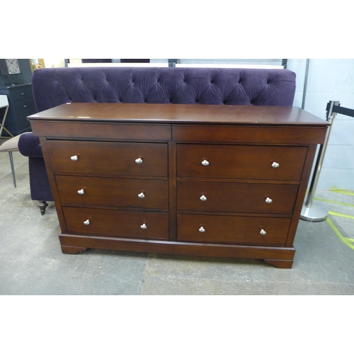 1544 - A darkwood eight drawer sideboard