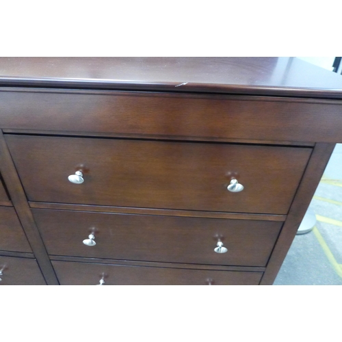 1544 - A darkwood eight drawer sideboard