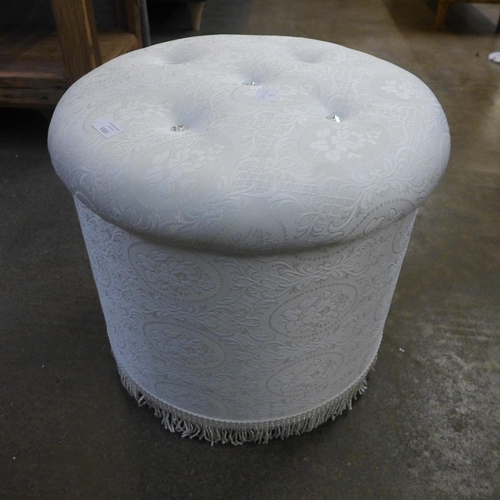 1553 - A white upholstered footstool *This lot is subject to VAT