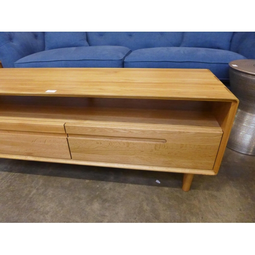 1572 - An oak two drawer TV unit *This lot is subject to VAT