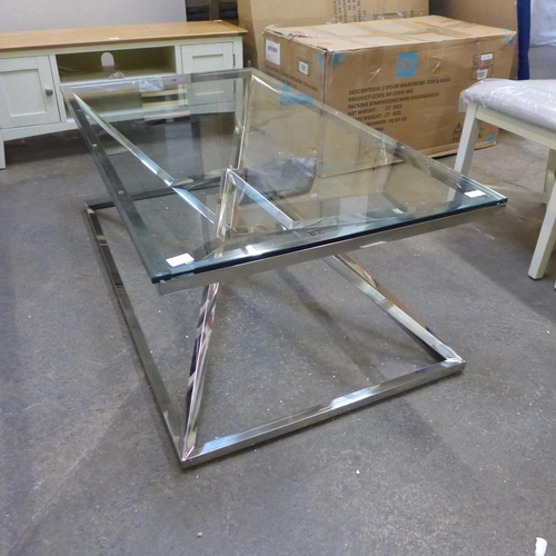 1575 - A chrome and glass rectangular coffee table *This lot is subject to VAT