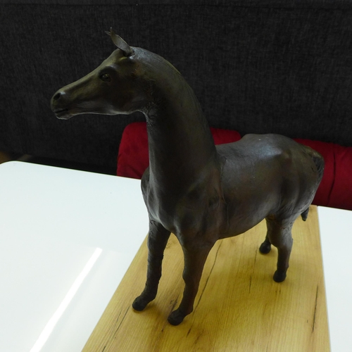 1587 - A leather wrapped horse figure (slight damage)