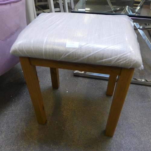 1596 - A grey fabric and oak stool *This Lot is Subject to VAT*