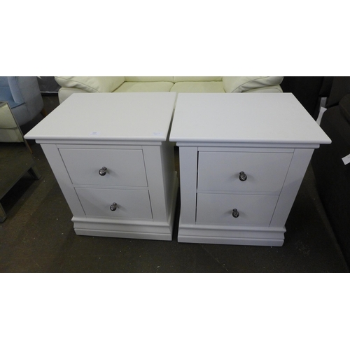 1602 - A pair of white bedside chests *This lot is subject to VAT