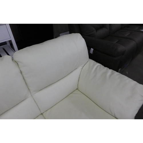 1603 - A cream Italian leather two seater sofa