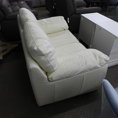 1603 - A cream Italian leather two seater sofa