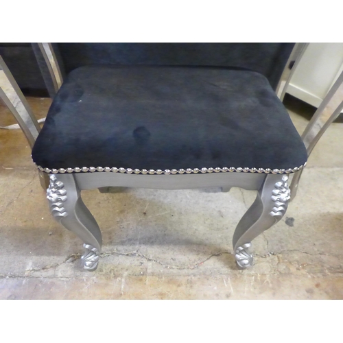 1610 - A mirrored dressing table and upholstered stool