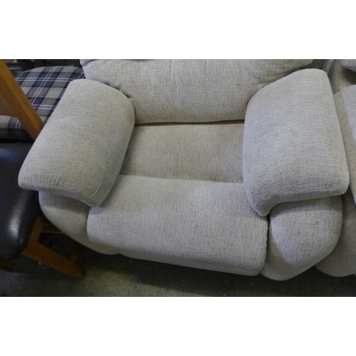 1663 - A light grey fabric three seater sofa and armchair