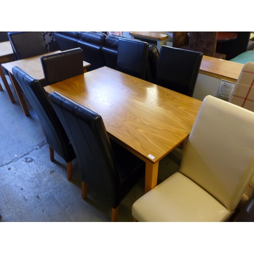 1665 - A 80 x 140 dining table and four chairs