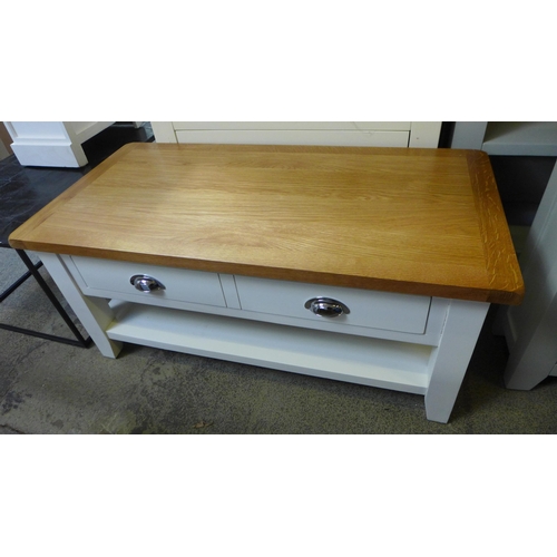 1706 - A Hampshire white painted and oak two over four chest and a coffee table (Damaged) *This lot is subj... 