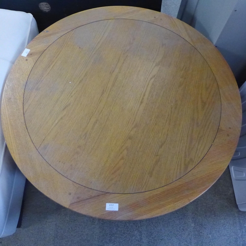 1717 - A circular oak coffee table (Damaged) *This lot is subject to VAT