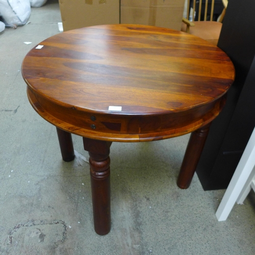 1724 - An Indian hardwood circular table, uneven *This lot is subject to VAT