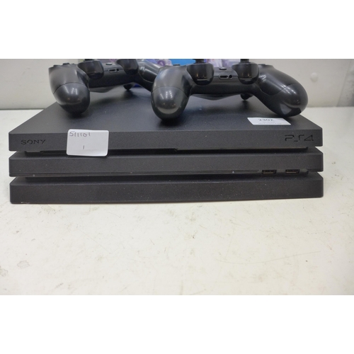 2302 - Sony Playstation 4Pro 1TB 4k gaming console with 2 controllers & 3 football games - W