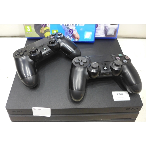 2302 - Sony Playstation 4Pro 1TB 4k gaming console with 2 controllers & 3 football games - W