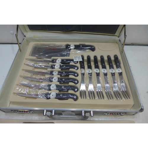 2328 - A Prima set of knives, cased