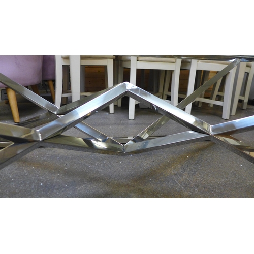 1340 - A chrome and glass rectangular coffee table *This lot is subject to VAT