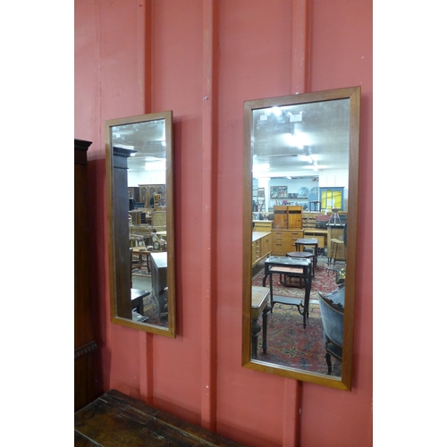 61 - A pair of Danish teak framed mirrors