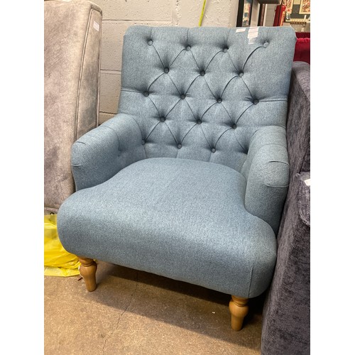 1391 - An Atlanta stone blue fabric button back armchair Display