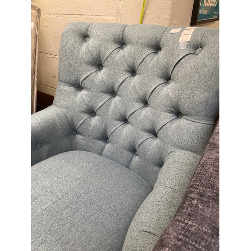 1391 - An Atlanta stone blue fabric button back armchair Display